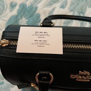 Coach black hand bag. Barely used due to it being too small.  Like new.